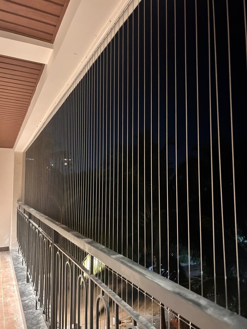 Premium invisible window grills installed in modern living room - Falcon Grills Delhi. Child-safe, unobstructed view